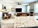 Open living room with ceiling fan, fireplace, and leather seating at 110 Serendipity Way, Dallas, GA 30157