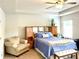 Bright main bedroom with tray ceilings, neutral decor, and private entrance to bathroom at 110 Serendipity Way, Dallas, GA 30157