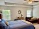 Bright main bedroom with tray ceilings, neutral decor, and large windows at 110 Serendipity Way, Dallas, GA 30157