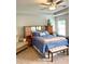 Bright main bedroom with tray ceilings, neutral decor, and ceiling fan at 110 Serendipity Way, Dallas, GA 30157
