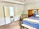 Bright main bedroom with tray ceilings, neutral decor, and private entrance to bathroom at 110 Serendipity Way, Dallas, GA 30157