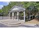 Community pavilion with picnic tables in a serene wooded setting, with easy access to the tennis courts at 110 Serendipity Way, Dallas, GA 30157