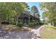 Community pavilion by the lake features picnic tables, lush landscaping, and scenic views for relaxation at 110 Serendipity Way, Dallas, GA 30157