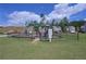 Community playground with various play structures, fenced for safety, and surrounded by green grass at 110 Serendipity Way, Dallas, GA 30157