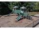 Community playground with multiple slides and climbing area with protective mulch at 110 Serendipity Way, Dallas, GA 30157