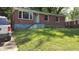 Charming single-story brick home with a well-maintained front yard, offering classic curb appeal at 2545 Saint Patrick Se St, Atlanta, GA 30317