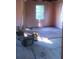 Renovation of the living room with a vintage window, paint, and exposed wall studs at 2545 Saint Patrick Se St, Atlanta, GA 30317