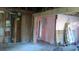An in-progress living room renovation showcasing exposed studs, plumbing, and a ladder at 2545 Saint Patrick Se St, Atlanta, GA 30317