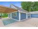 Side view of a home with a spacious deck and green backyard at 4002 Joshua Ln, Douglasville, GA 30135