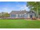 Green backyard showcasing a spacious deck and charming pergola at 4002 Joshua Ln, Douglasville, GA 30135