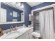 Cozy blue bathroom with tub/shower combo and updated vanity at 4002 Joshua Ln, Douglasville, GA 30135