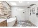 Beautiful bathroom featuring a soaking tub, modern tile, and a rainfall shower at 4002 Joshua Ln, Douglasville, GA 30135
