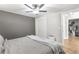 Bedroom featuring a tufted headboard, neutral color palette, and closet space at 4002 Joshua Ln, Douglasville, GA 30135