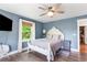 Bright bedroom with window, tv, and comfortable bed at 4002 Joshua Ln, Douglasville, GA 30135