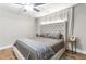 Bedroom with a tufted headboard, neutral color palette, and an accent wall with light-blocking curtains at 4002 Joshua Ln, Douglasville, GA 30135