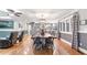 Open-concept dining and living area with hardwood floors and windows allowing for natural light at 4002 Joshua Ln, Douglasville, GA 30135