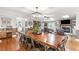 Spacious dining area with a large table, hardwood floors, and adjacent living area at 4002 Joshua Ln, Douglasville, GA 30135