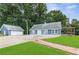 Charming blue house with a spacious front yard and detached garage at 4002 Joshua Ln, Douglasville, GA 30135