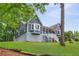 Beautiful home featuring a cozy porch, bay window, and well-manicured lawn offers inviting outdoor living space at 4002 Joshua Ln, Douglasville, GA 30135