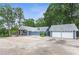 Charming property includes a large, detached garage with a spacious driveway at 4002 Joshua Ln, Douglasville, GA 30135