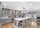 Stylish kitchen with large island, pendant lighting, stainless steel appliances, and hardwood flooring at 4002 Joshua Ln, Douglasville, GA 30135