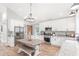 Beautiful kitchen with white cabinets, stainless steel appliances, and farmhouse-style dining area at 4002 Joshua Ln, Douglasville, GA 30135