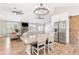 Kitchen/living area with stainless steel appliances, breakfast nook, and open layout at 4002 Joshua Ln, Douglasville, GA 30135