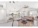 Open-concept living room boasts hardwood floors, modern design, and seamless transition to kitchen at 4002 Joshua Ln, Douglasville, GA 30135