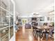 View of open-concept living area featuring a dining table, hardwood floors and neutral paint tones at 4002 Joshua Ln, Douglasville, GA 30135