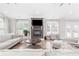 Inviting living room features a fireplace, large windows, and comfortable seating at 4002 Joshua Ln, Douglasville, GA 30135