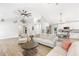 Spacious living room with modern furnishings, hardwood floors, and open to kitchen area at 4002 Joshua Ln, Douglasville, GA 30135