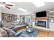 A comfortable living area with fireplace, built-in shelving, and ample seating at 4002 Joshua Ln, Douglasville, GA 30135