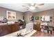 Home office with a large desk, storage cabinets, and natural light from the window at 4002 Joshua Ln, Douglasville, GA 30135