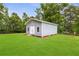 Charming outbuilding on a well-maintained lawn, offering versatile space for storage, hobbies, or creative pursuits at 4002 Joshua Ln, Douglasville, GA 30135