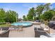Relaxing backyard showcasing an above-ground pool, spacious deck, and outdoor seating, ideal for entertaining guests at 4002 Joshua Ln, Douglasville, GA 30135