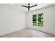 Bright bedroom with hardwood floors and a large window looking out onto the trees at 1312 Becket Ne Dr, Brookhaven, GA 30319