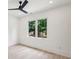 Bedroom with white walls, wood floors and backyard view at 1312 Becket Ne Dr, Brookhaven, GA 30319