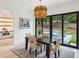 Dining room adjacent to the kitchen with view of outdoor pool and living spaces at 1312 Becket Ne Dr, Brookhaven, GA 30319