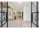 Bright foyer with herringbone floors, glass front door and windows, views to the formal and informal spaces at 1312 Becket Ne Dr, Brookhaven, GA 30319