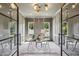 Stylish office space featuring gray walls, glass doors and windows, and a modern light fixture at 1312 Becket Ne Dr, Brookhaven, GA 30319