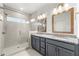 Bathroom with double vanity with granite countertops and tiled walk-in shower at 2140 Colvin Nw Ct, Atlanta, GA 30318