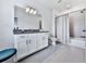 Bathroom featuring a large vanity with granite countertop and tiled shower with tub at 2140 Colvin Nw Ct, Atlanta, GA 30318