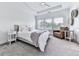 Spacious bedroom featuring plush carpet, ample natural light, and a cozy seating area at 2140 Colvin Nw Ct, Atlanta, GA 30318