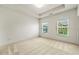 Bedroom with carpet and two windows at 2140 Colvin Nw Ct, Atlanta, GA 30318