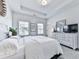 Bright bedroom features a tray ceiling, large windows, and a neutral color palette at 2140 Colvin Nw Ct, Atlanta, GA 30318
