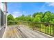 Wooden deck overlooking lush green foliage and blue skies at 2140 Colvin Nw Ct, Atlanta, GA 30318