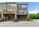 Townhome exterior featuring private garages and outdoor living spaces at 2140 Colvin Nw Ct, Atlanta, GA 30318