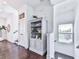Hallway with hardwood floors, built-in shelving and storage, and a large window for natural light at 2140 Colvin Nw Ct, Atlanta, GA 30318