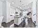 Modern kitchen features white cabinetry, hardwood floors, stainless appliances, and granite countertops at 2140 Colvin Nw Ct, Atlanta, GA 30318