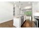 Kitchen island with stainless steel dishwasher, granite countertop, and views of the living room at 2140 Colvin Nw Ct, Atlanta, GA 30318